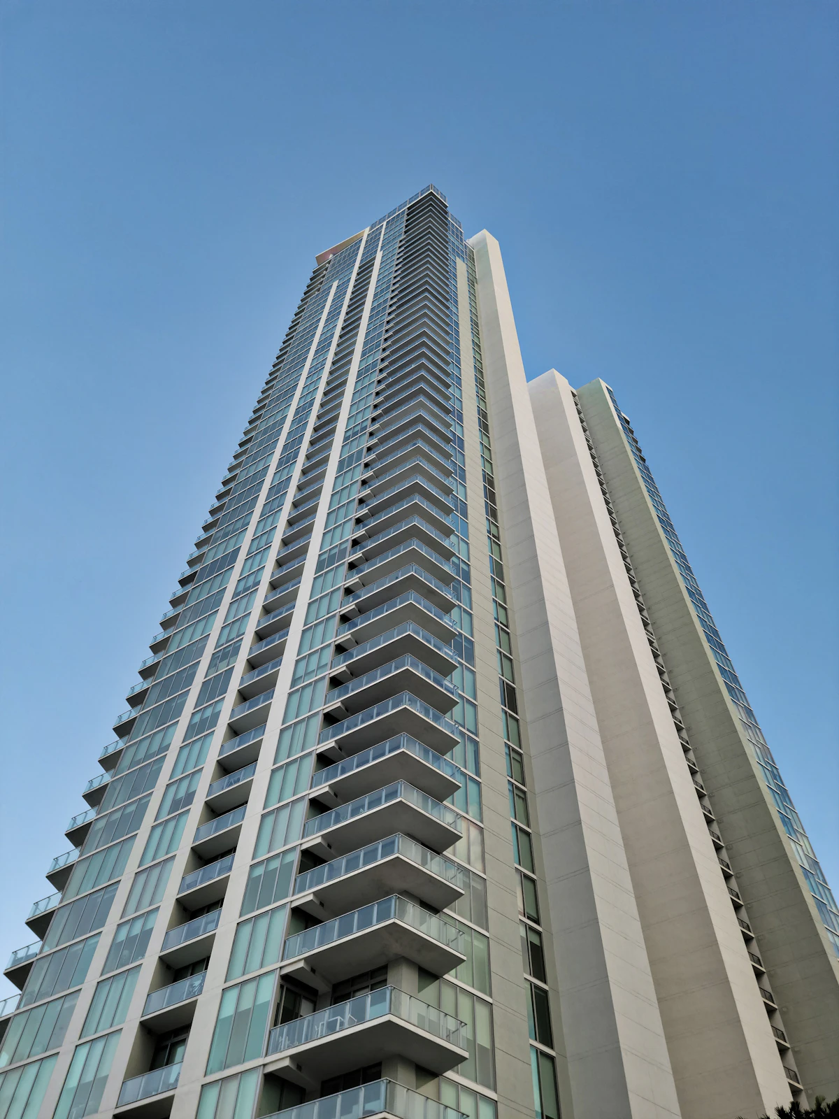 White concrete building under blue sky during daytime