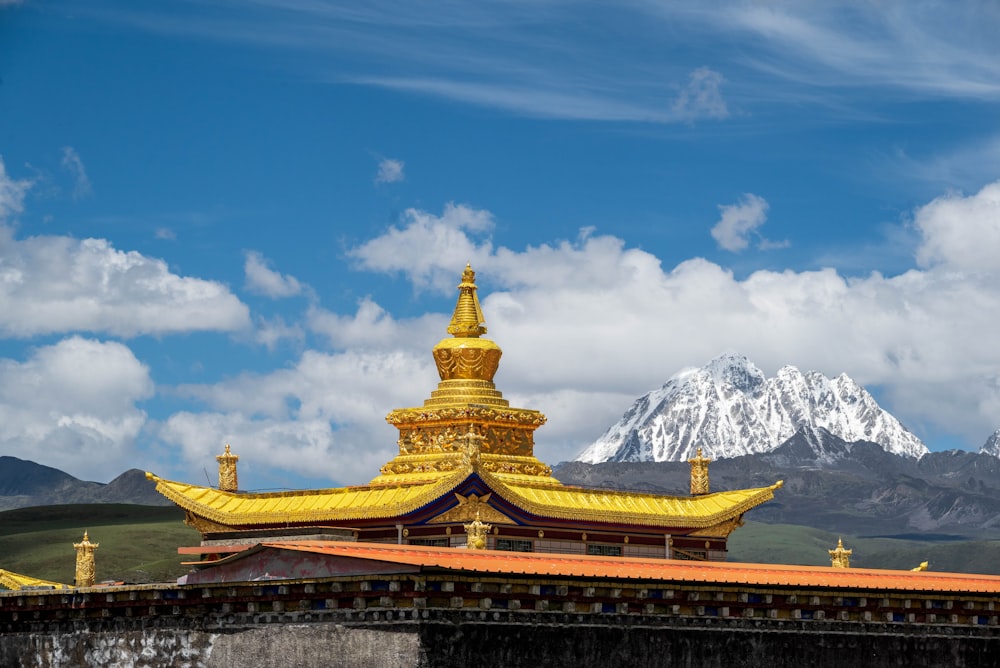 gold and white temple under blue sky