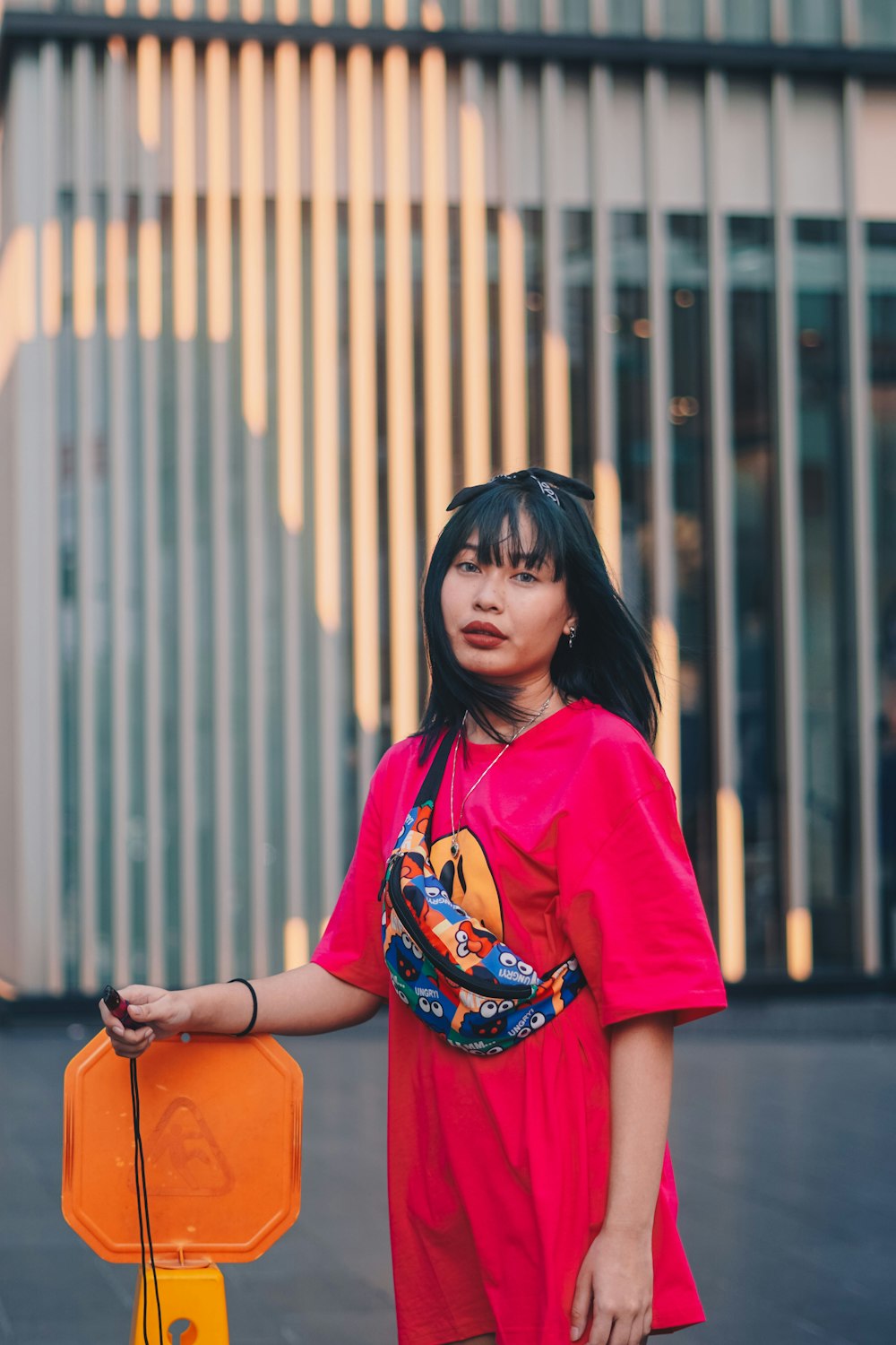 woman in red crew neck t-shirt and black framed eyeglasses