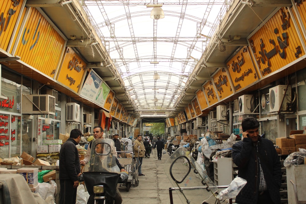 people in a train station during daytime