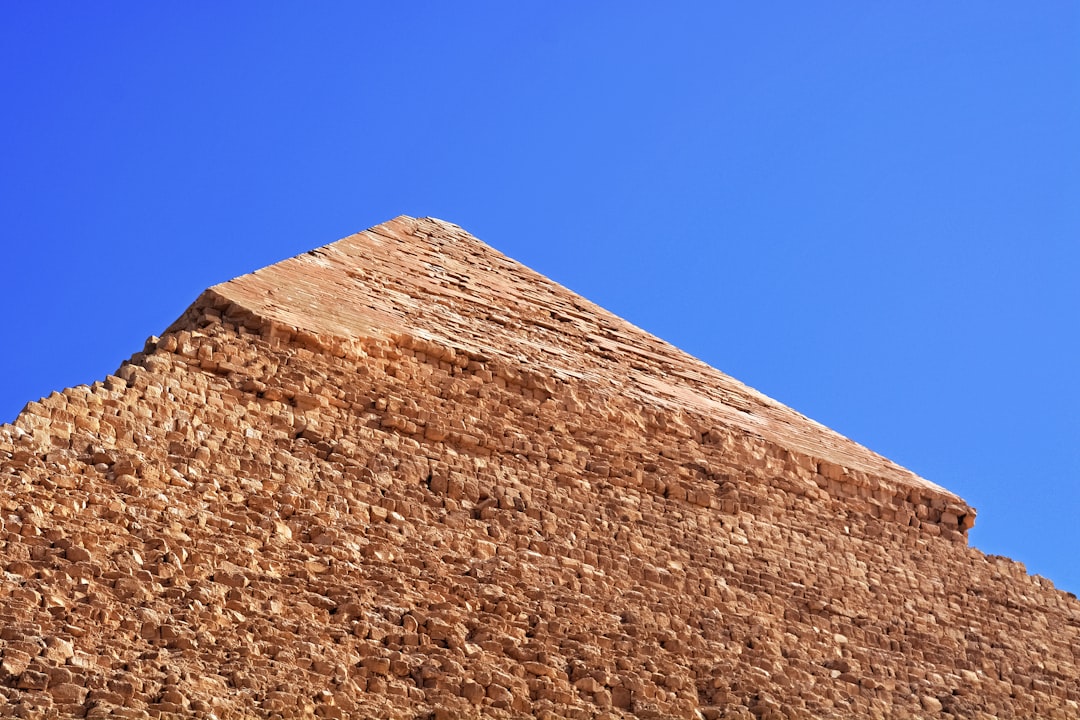 brown concrete wall under blue sky during daytime