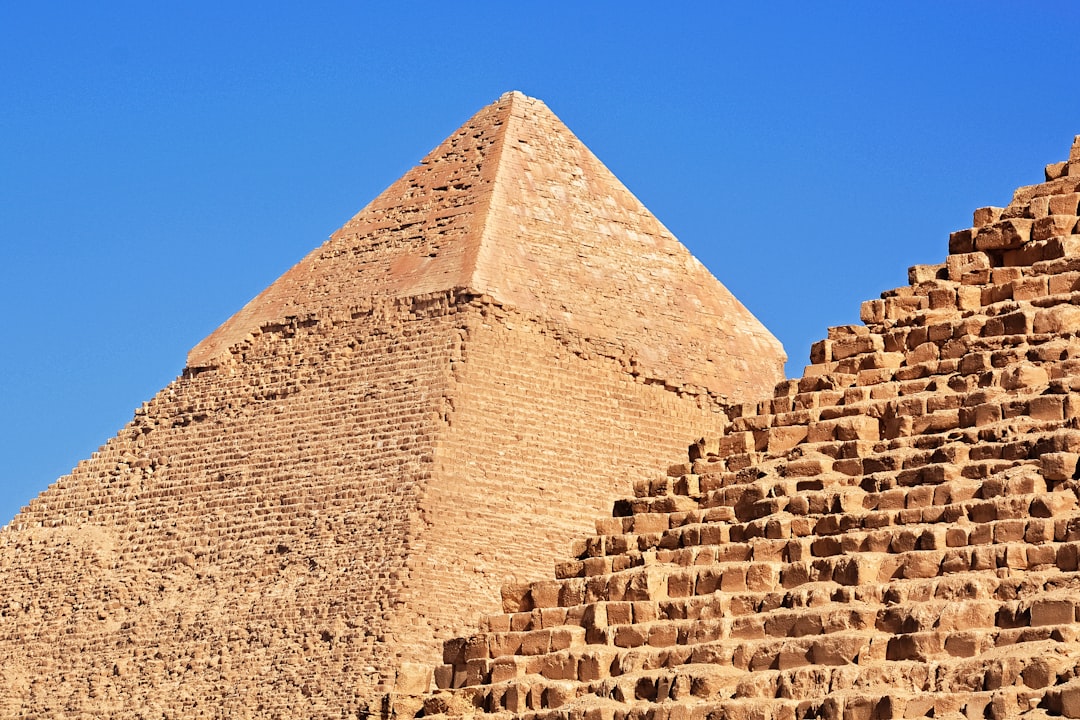 brown brick wall under blue sky during daytime