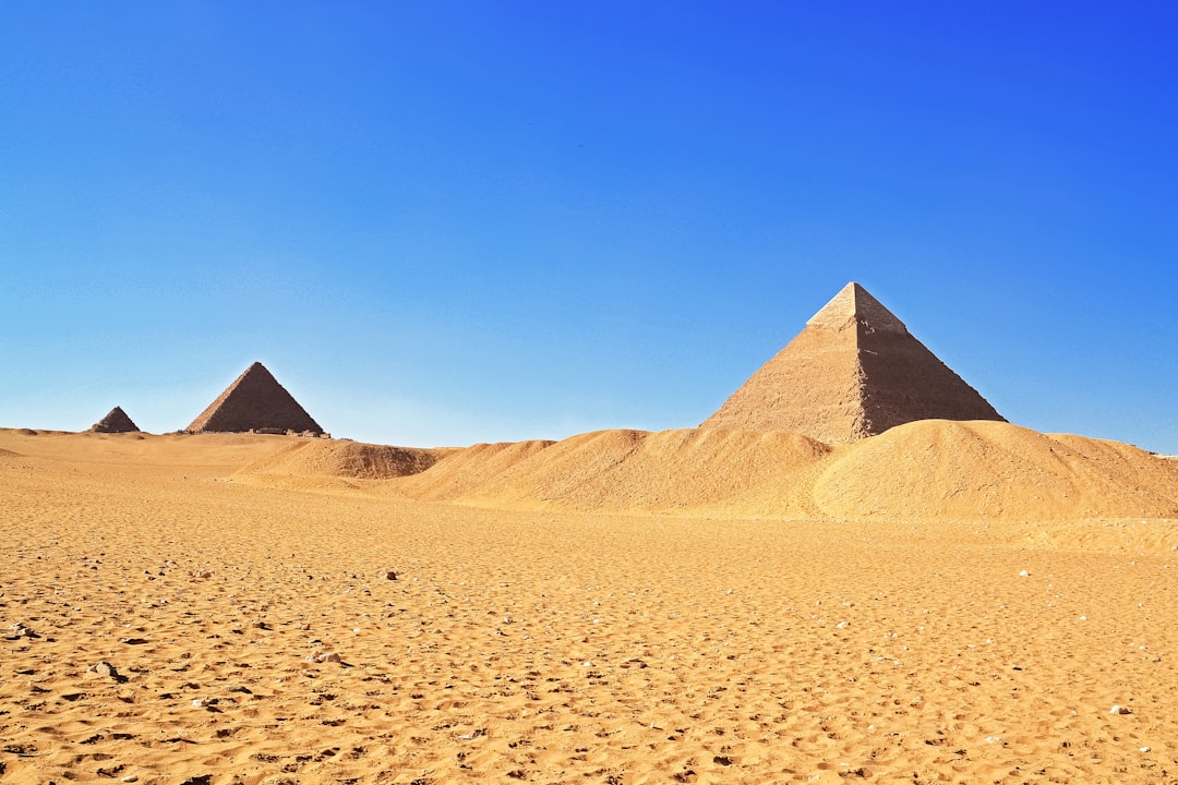 brown pyramid under blue sky during daytime