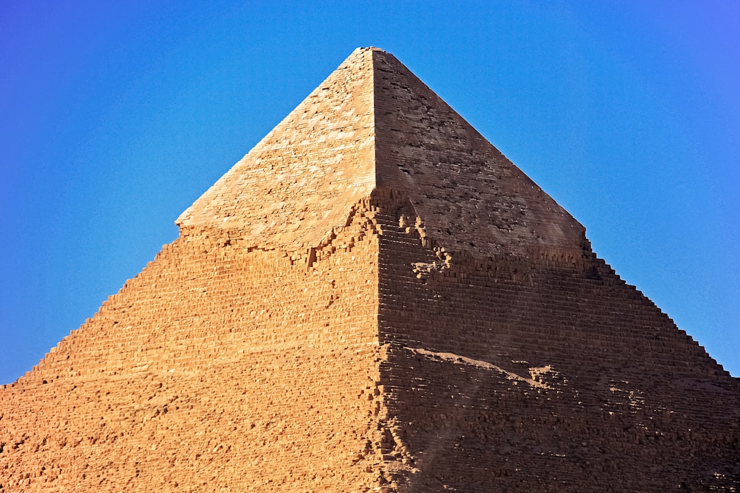 brown concrete wall under blue sky during daytime