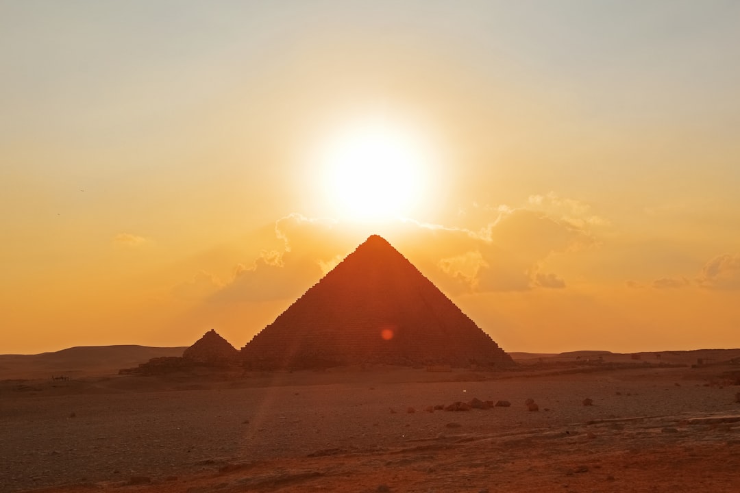 brown pyramid on brown sand during daytime