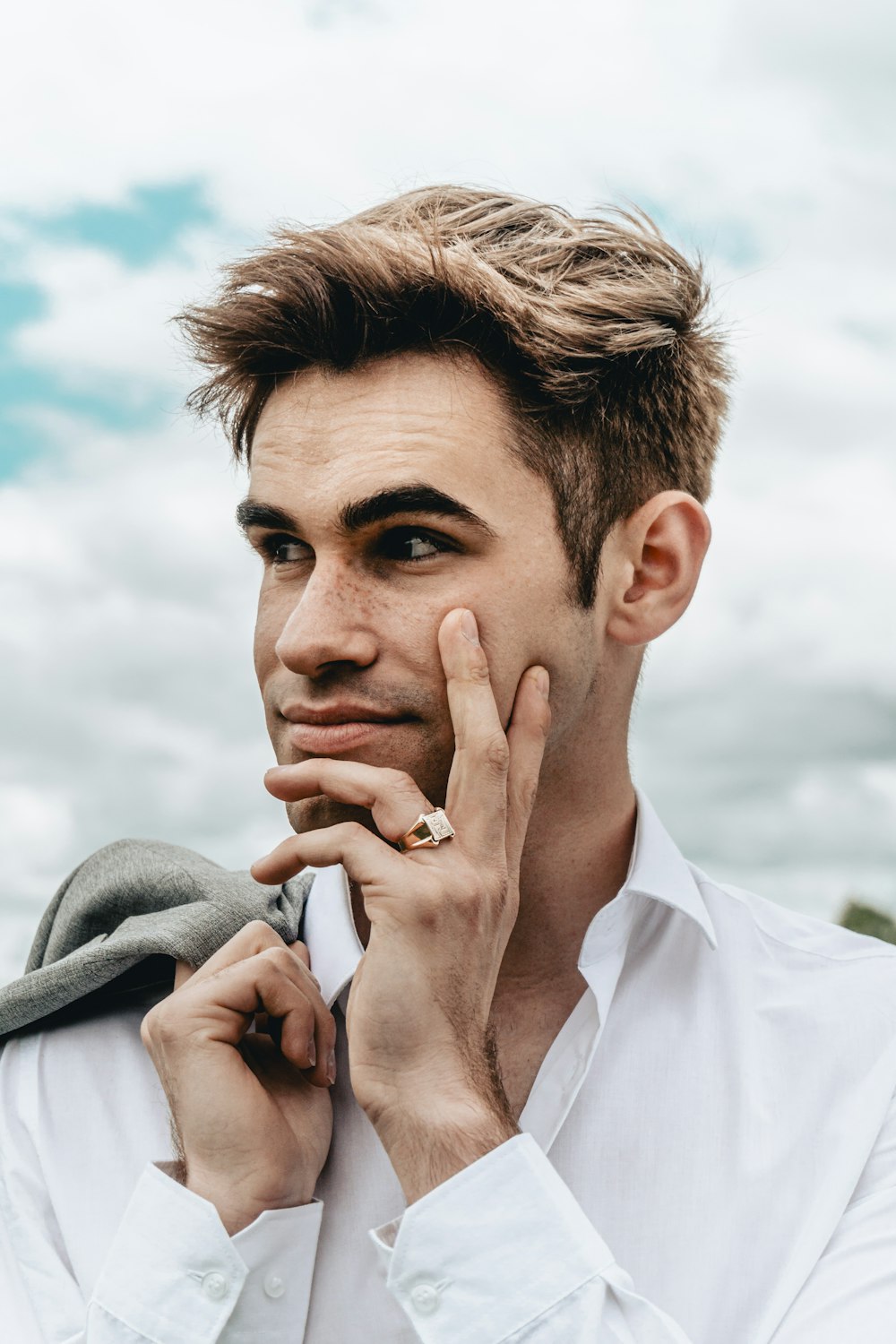 man in white dress shirt with gray scarf