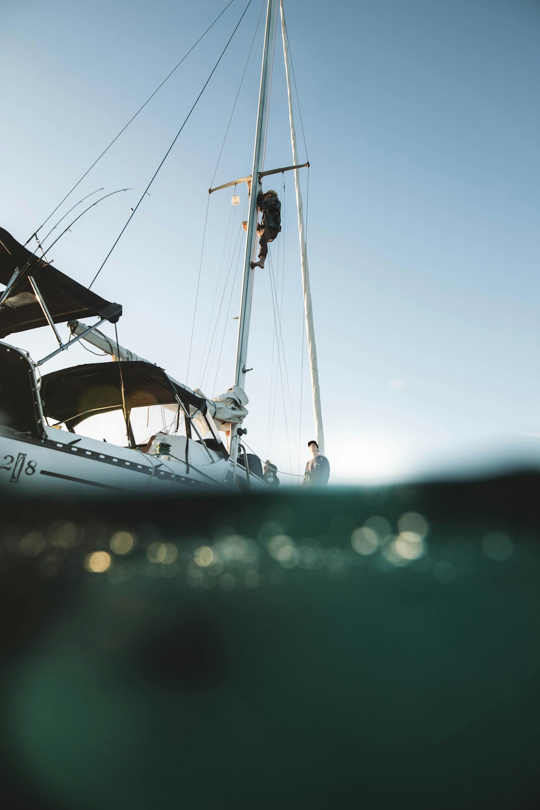 white sail boat on water during daytime