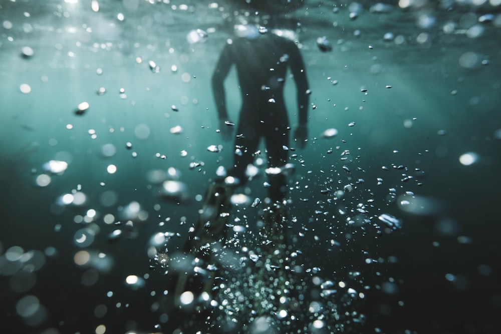 person in water with water droplets