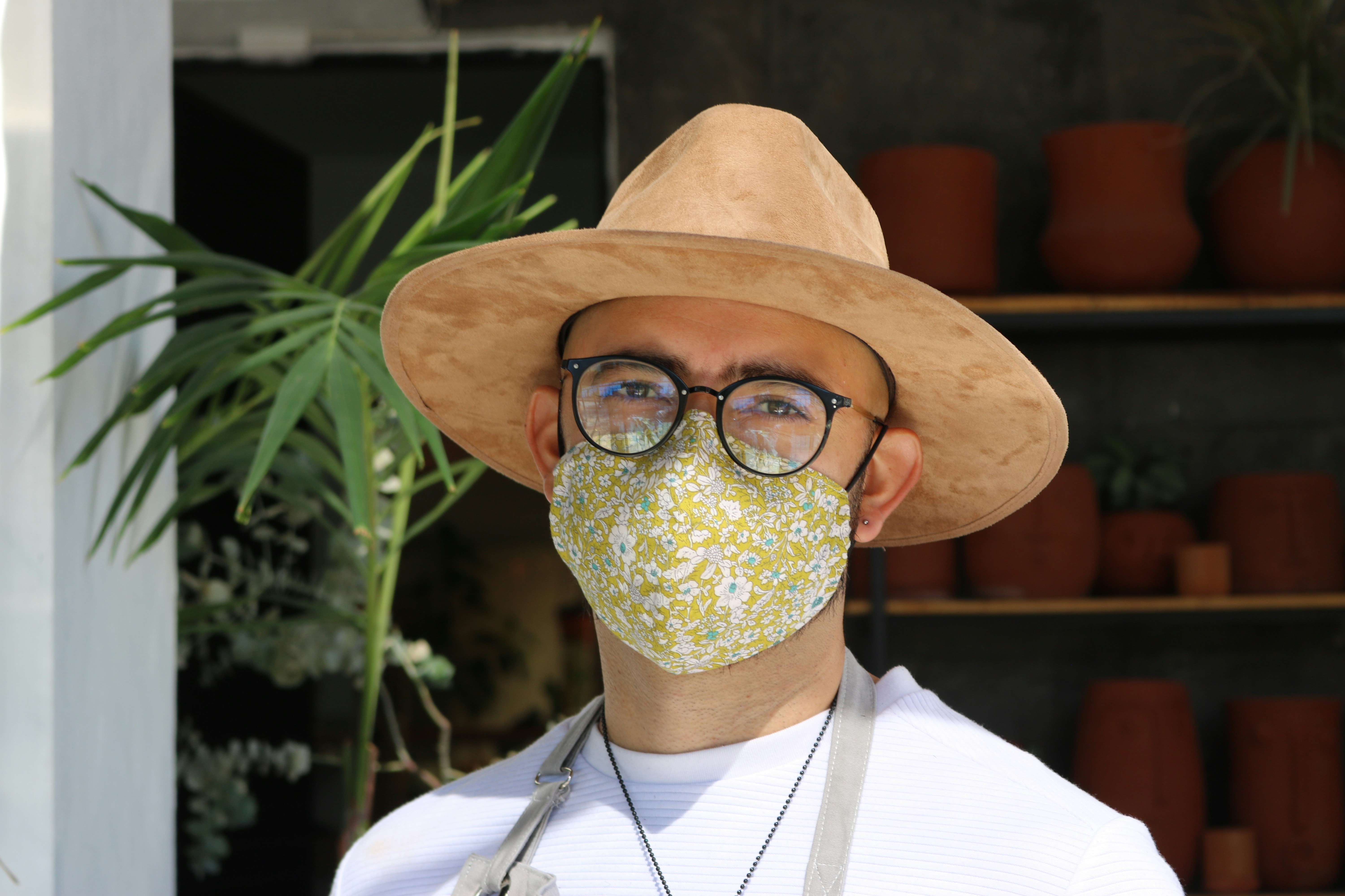 person wearing brown hat and eyeglasses