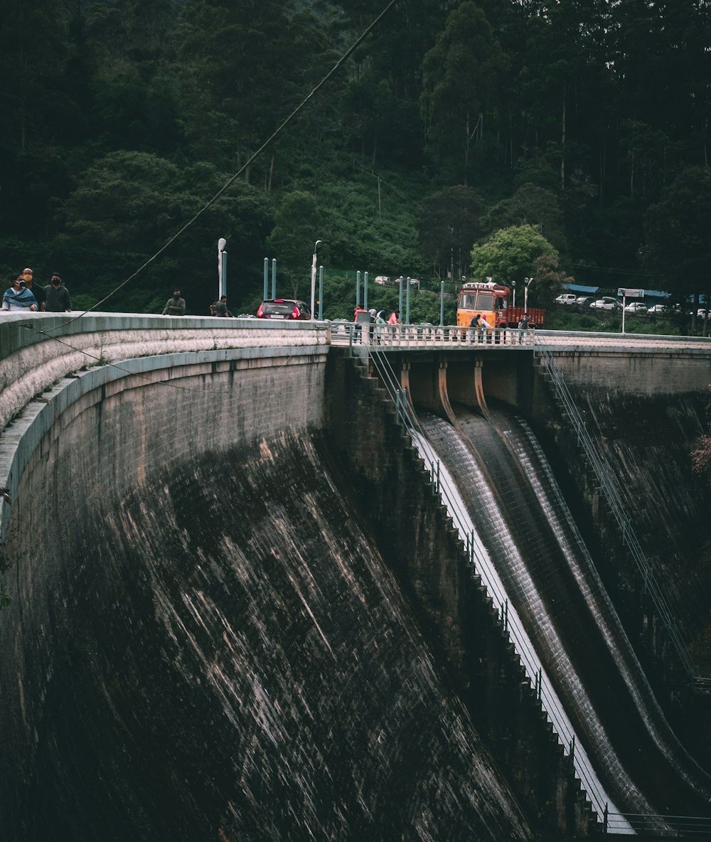 people walking on concrete bridge during daytime