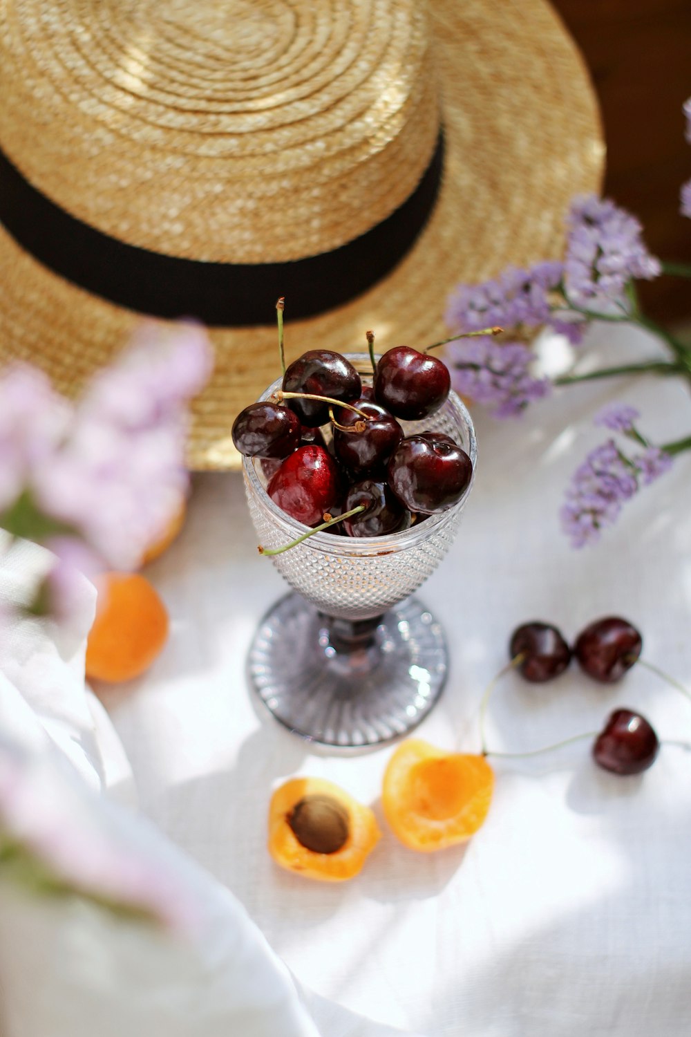 red cherries on clear glass bowl