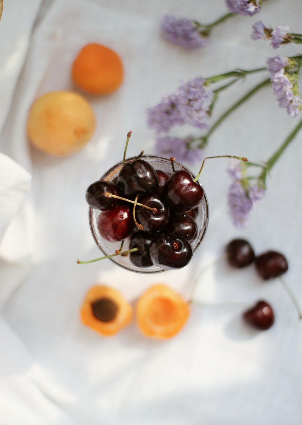 purple grapes on white textile