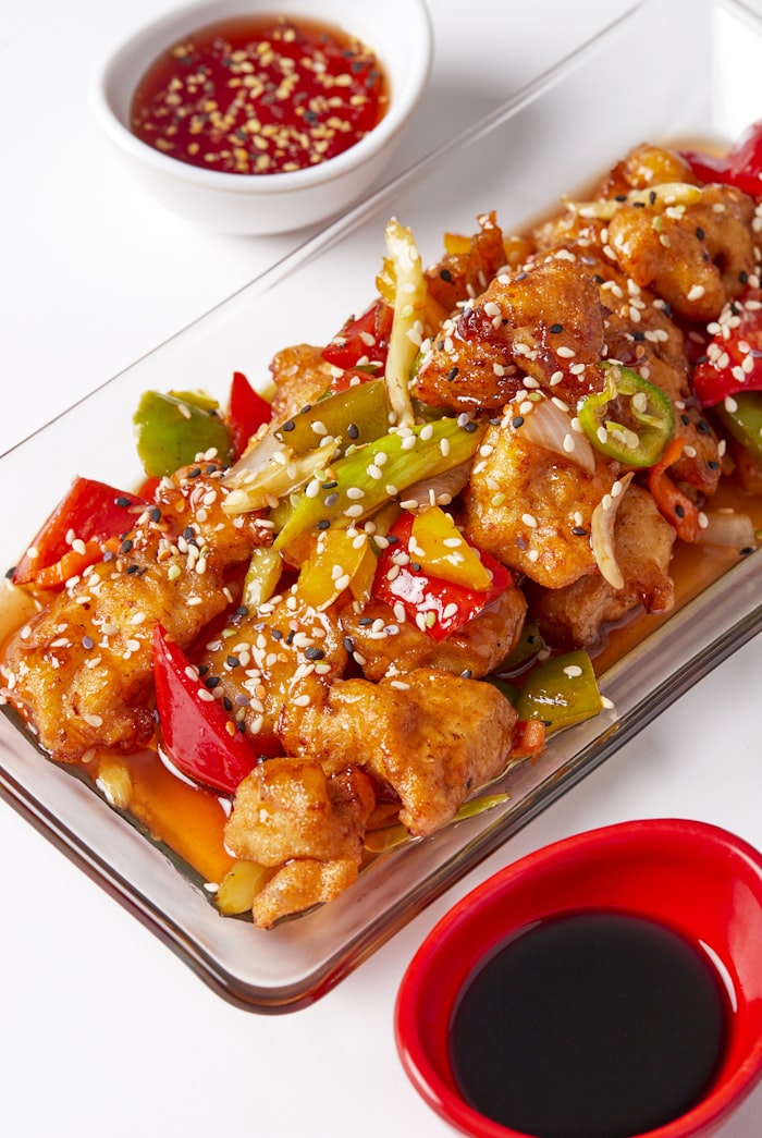 Glistening Cantonese roast goose hanging in a shopfront window