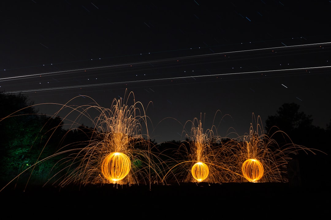 steel wool photography of orange lights
