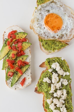 sliced tomato and green vegetable on white ceramic plate