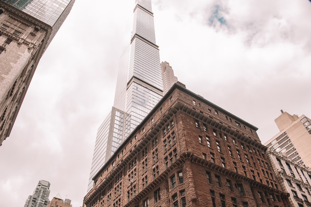 brown concrete building under white clouds during daytime