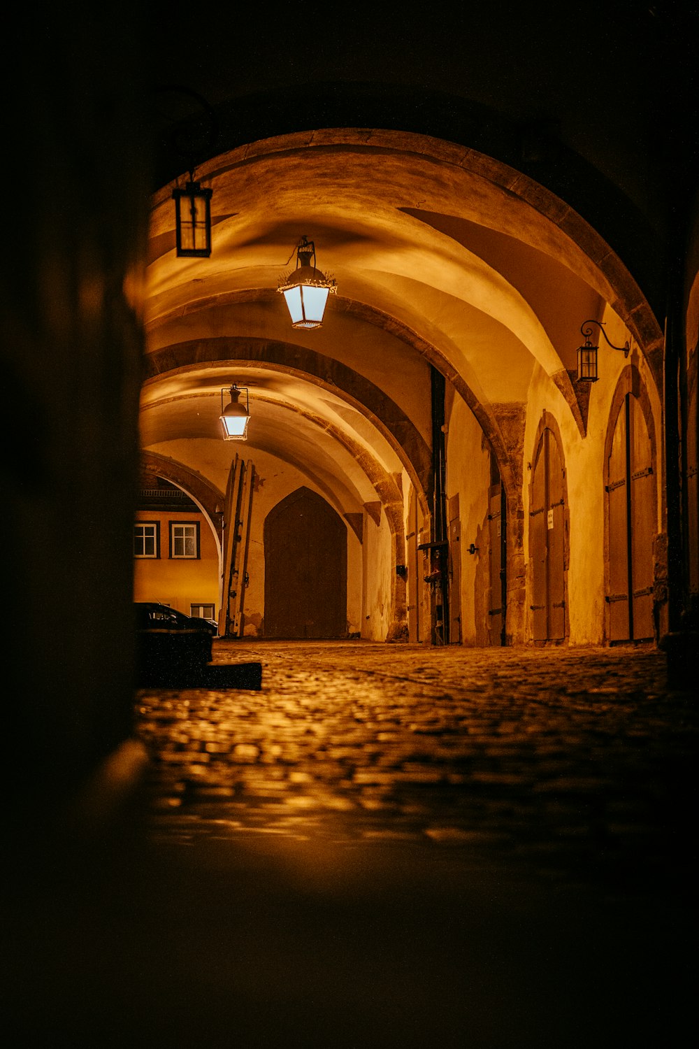 brown and black tunnel with light