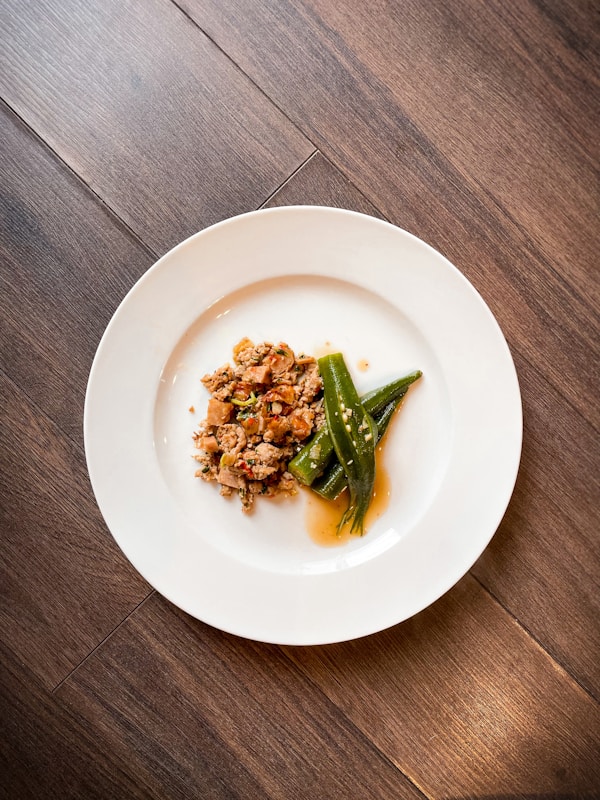 Green vegetable on white ceramic plate