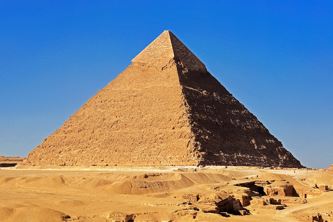 pyramid on desert under blue sky during daytime