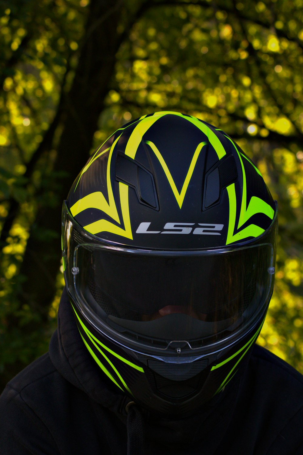 person wearing black and yellow helmet