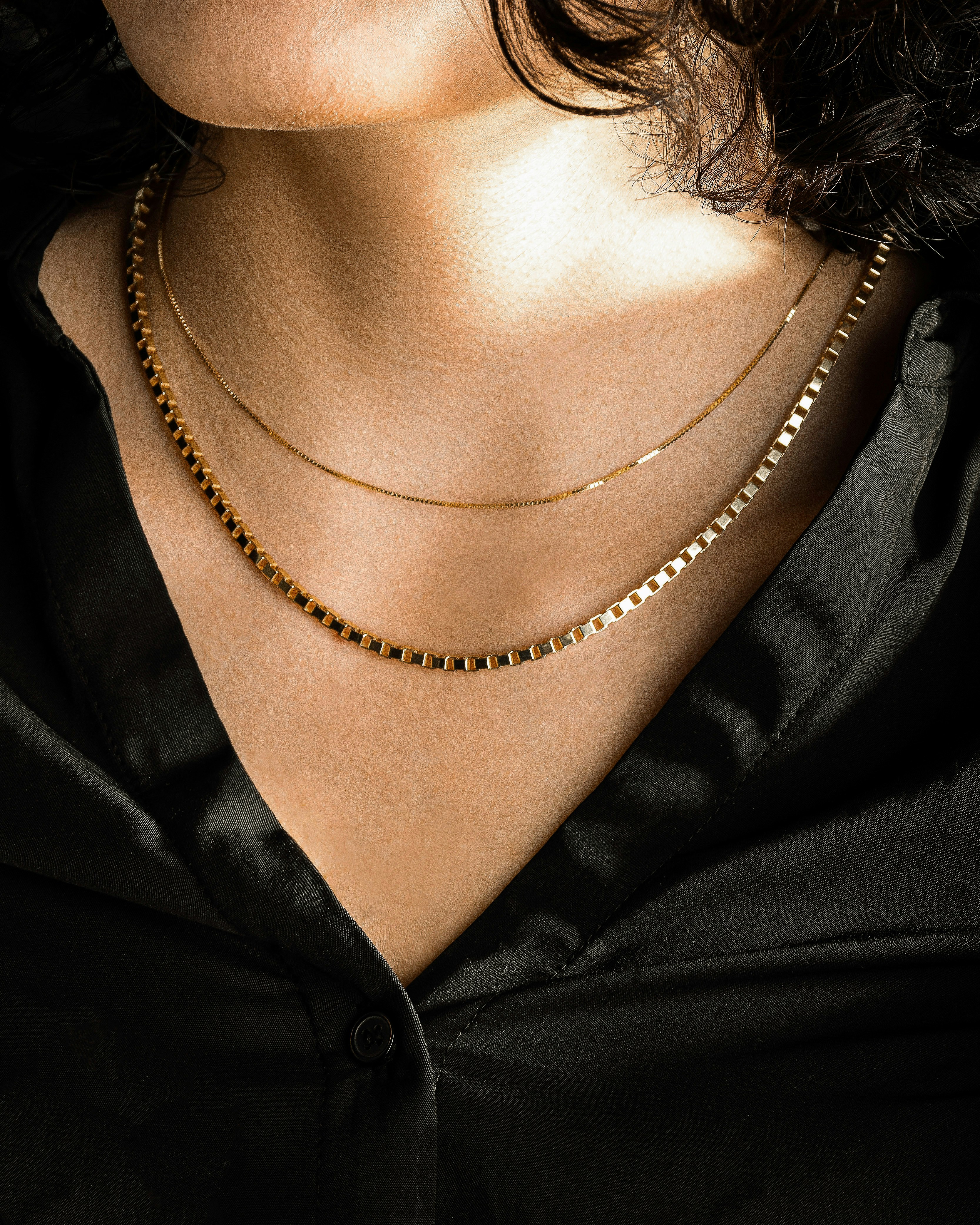person wearing silver chain necklace photo Free Accessory Image on