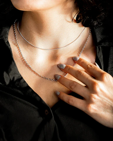 woman wearing silver and brown beaded necklace