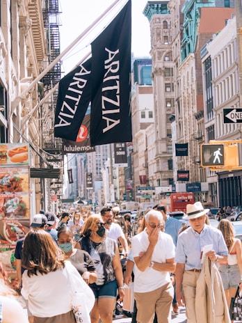 A vibrant city street in Toronto bustling with diverse crowds.