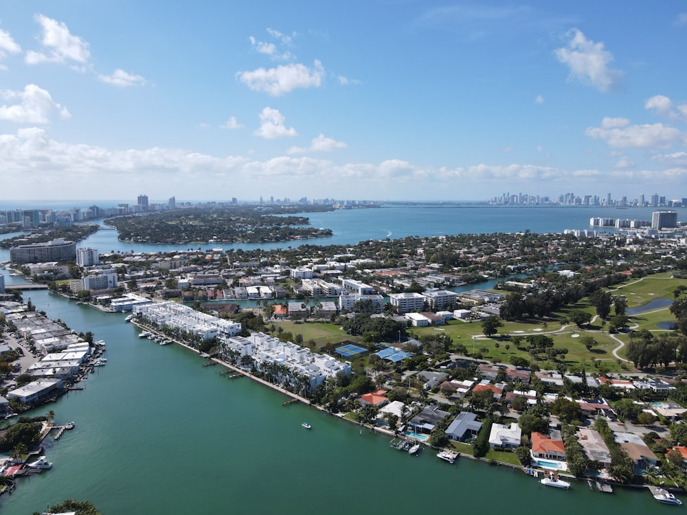 aerial view of city buildings near body of water during daytime