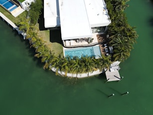 white and green boat on water
