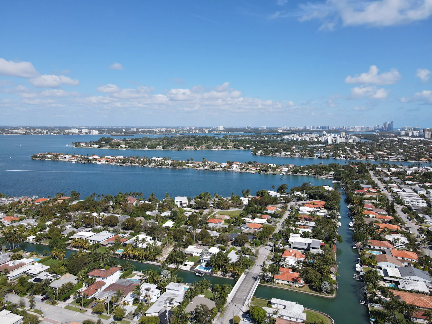 An aerial view of a canal-lined Florida community meeting open water