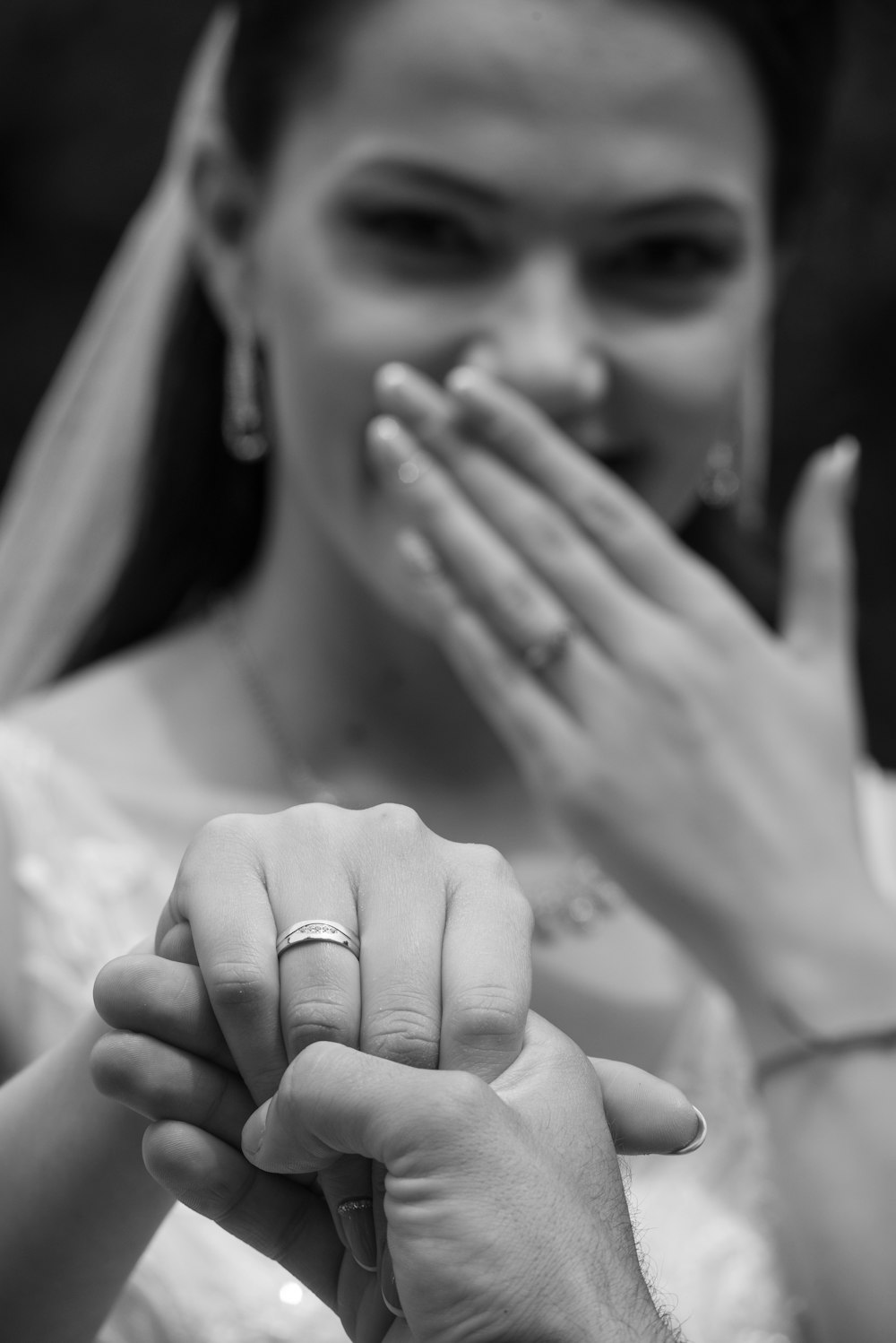 grayscale photo of woman wearing ring