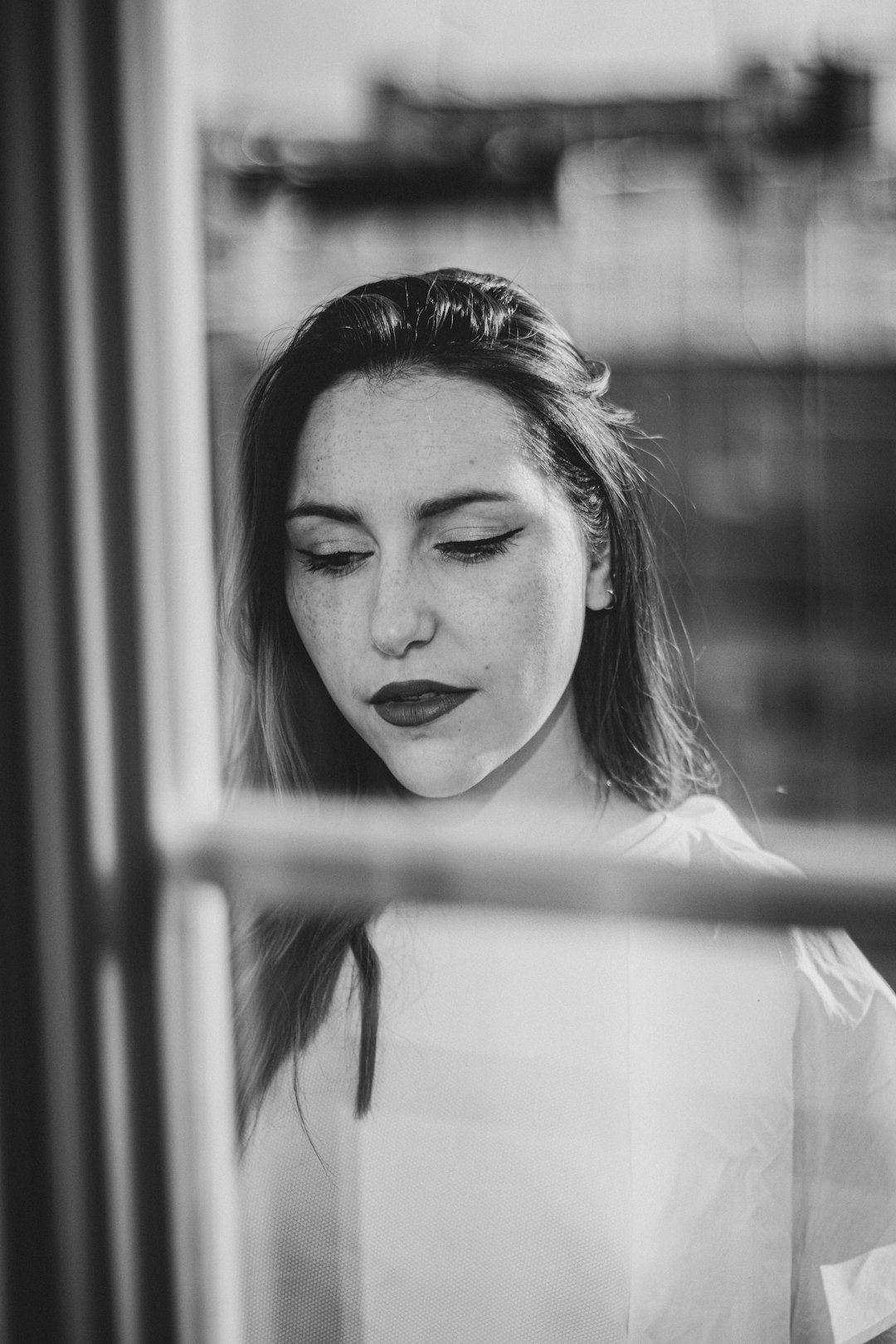 grayscale photo of woman in black shirt