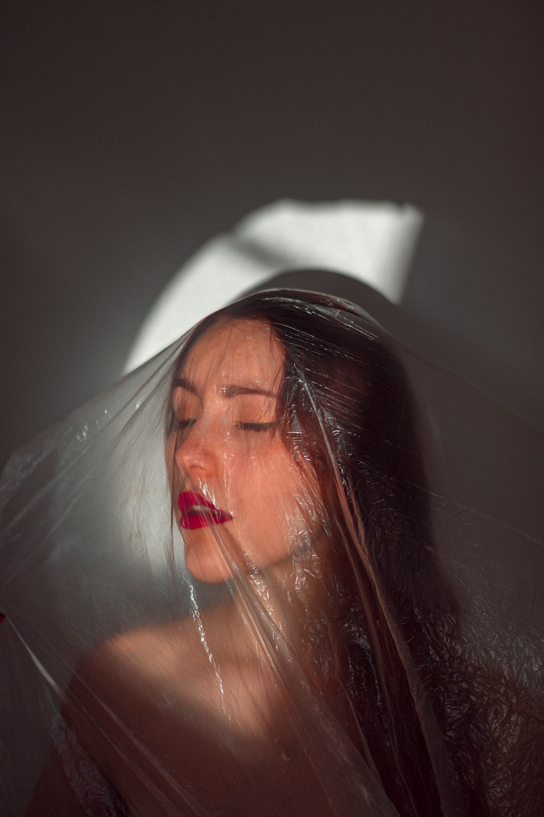 woman in white veil with red lipstick