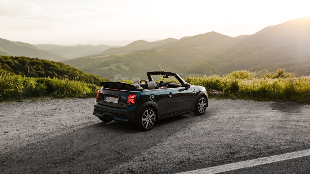 black convertible car on road during daytime