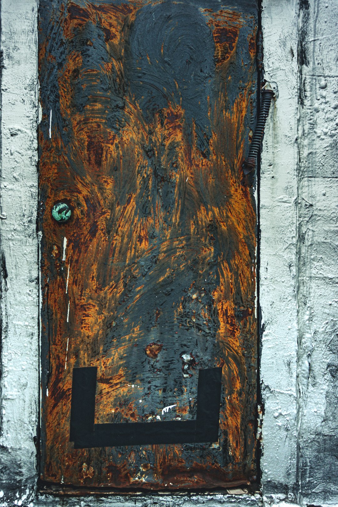 brown wooden door with silver door knob
