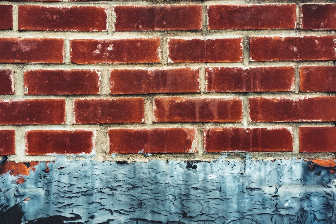 red brick wall with water droplets