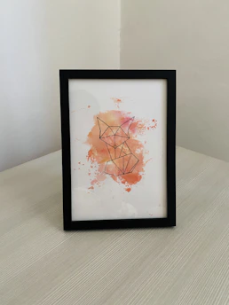 Close-up of a delicate abstract line drawing of a fox, inked with fine pen strokes on textured paper.