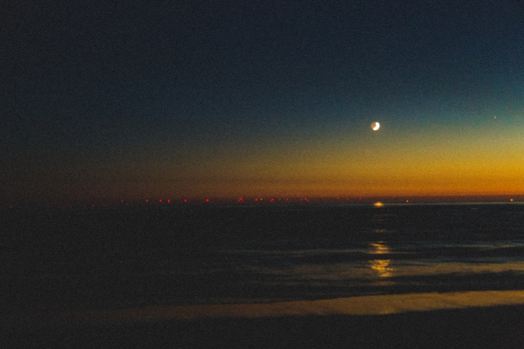 body of water during sunset