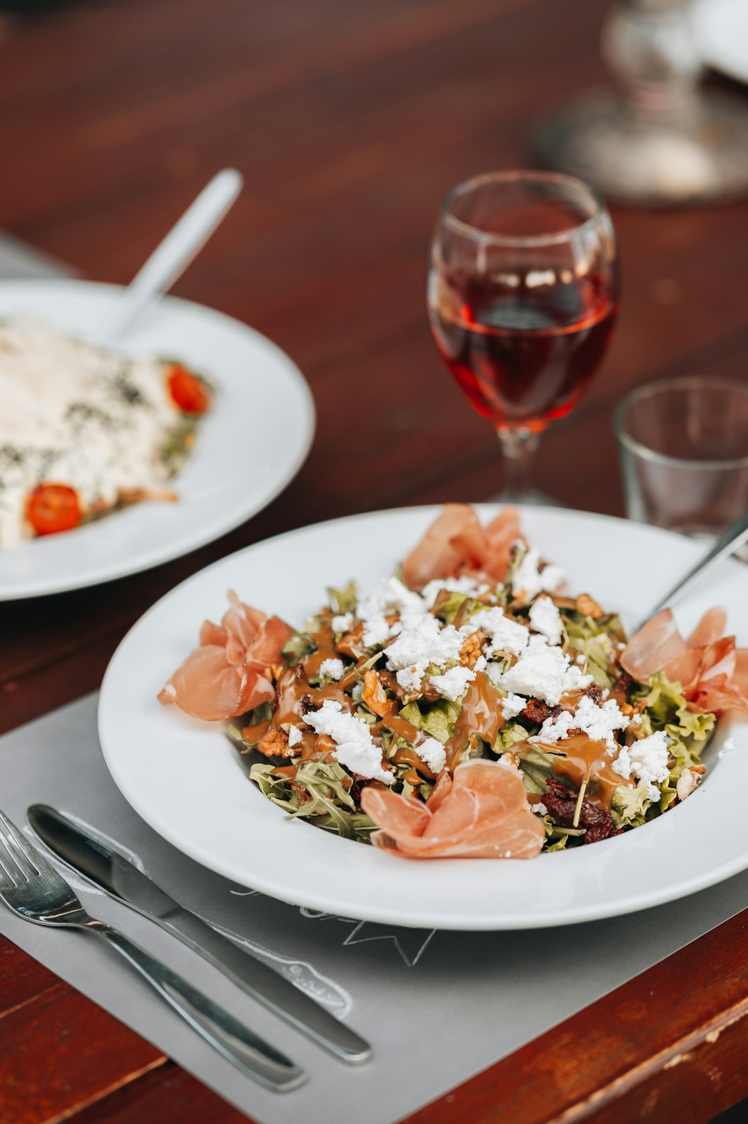 white ceramic plate with rice and vegetable salad