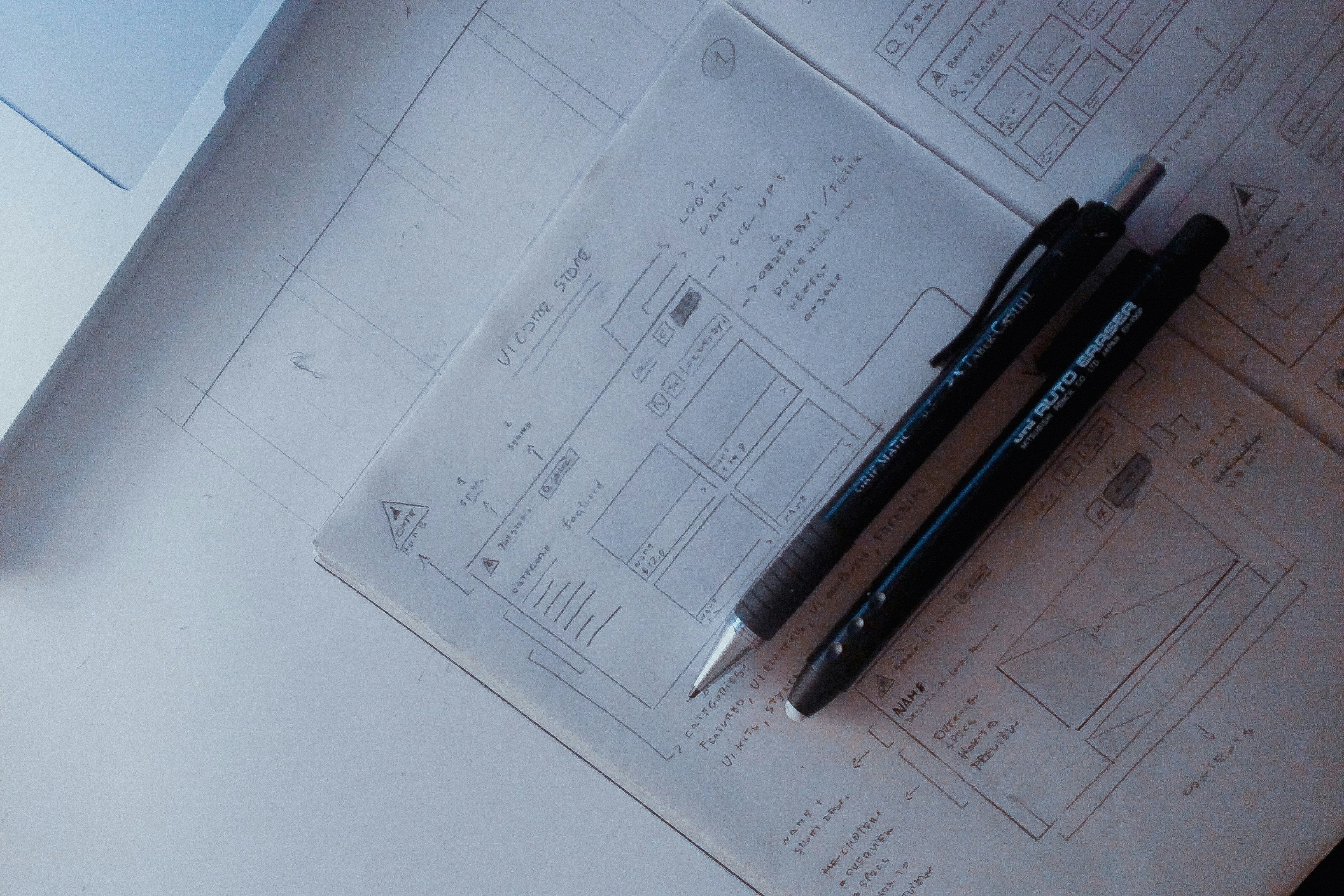 Modern UI/UX design interface showing wireframes, prototypes and design system components