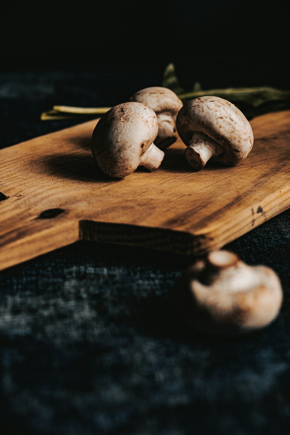 brown mushrooms on brown wooden chopping board