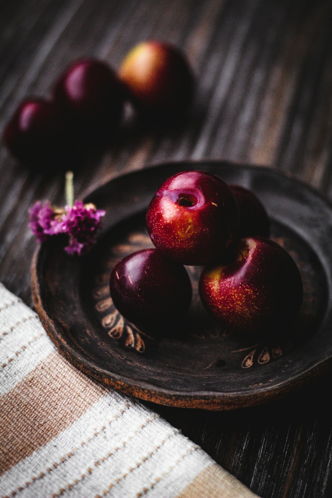 red round fruits on black round plate