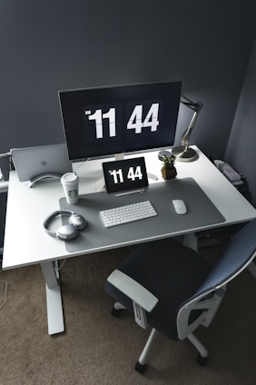 silver imac on white table