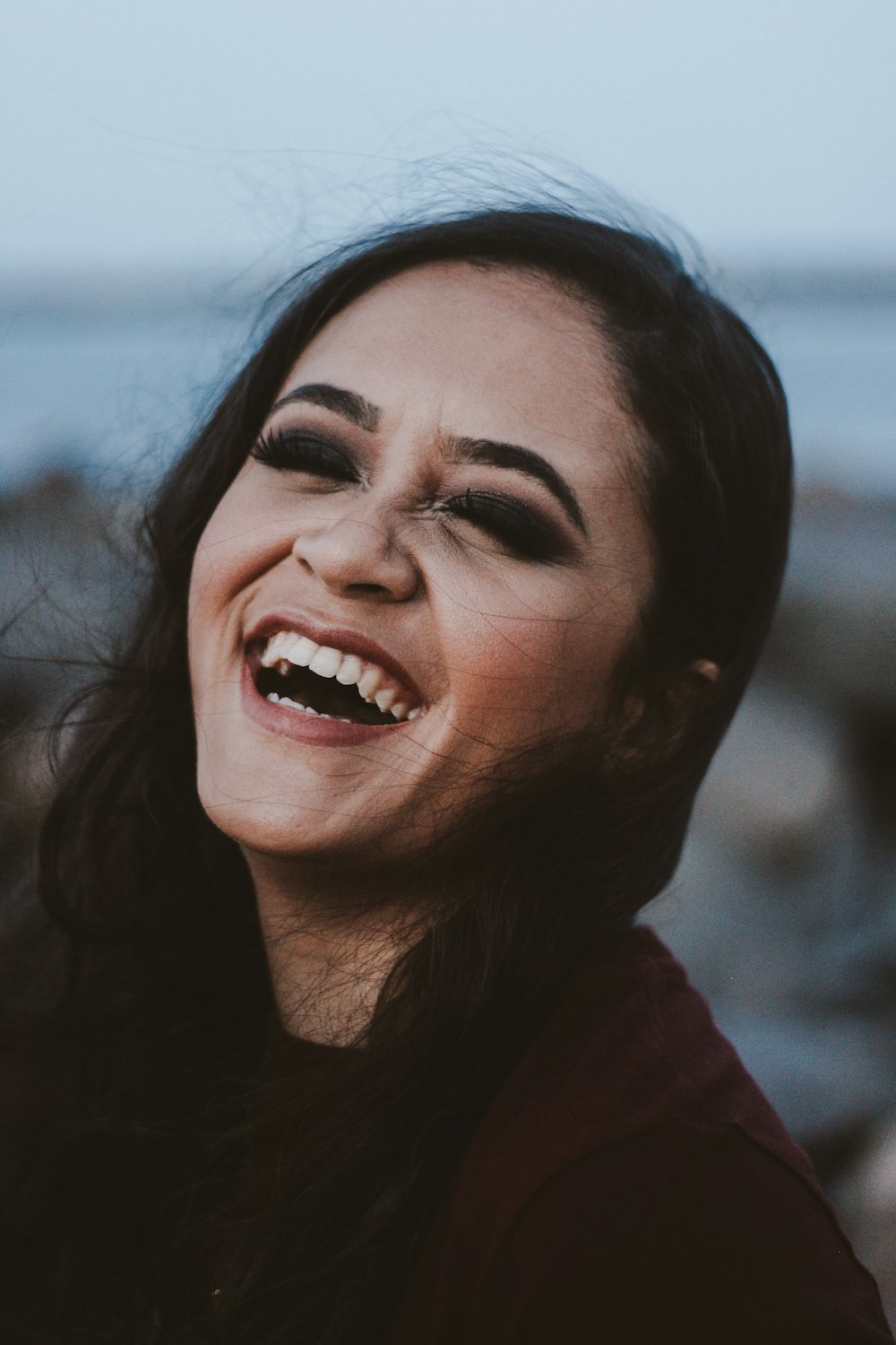 smiling woman in red shirt