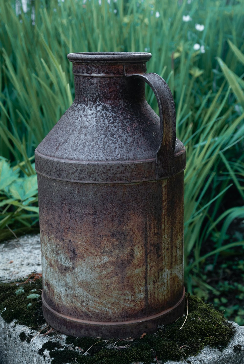 brown steel tank near green grass during daytime