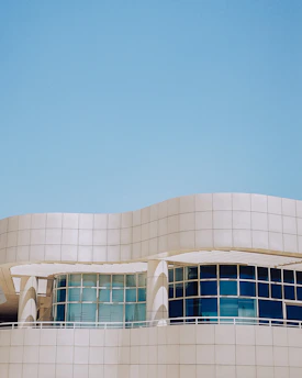 A modern industrial factory with clean lines and blue tones reflecting technology and innovation.