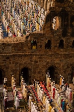 people in traditional dress standing on brown concrete building during daytime