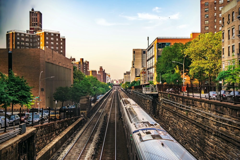 train rail near brown concrete building during daytime