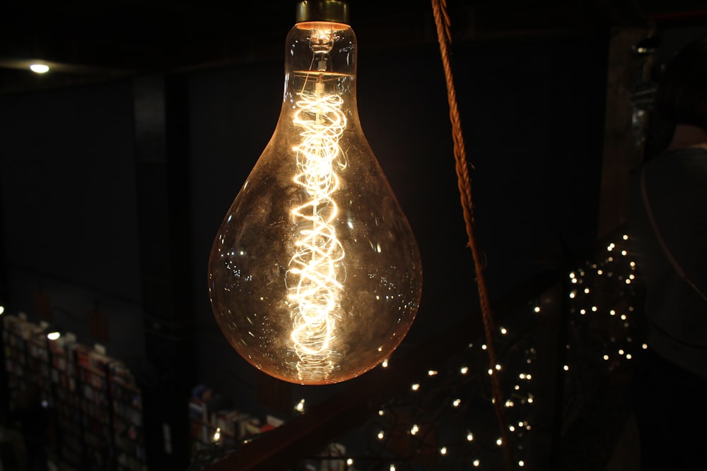 clear glass pendant lamp turned on during nighttime