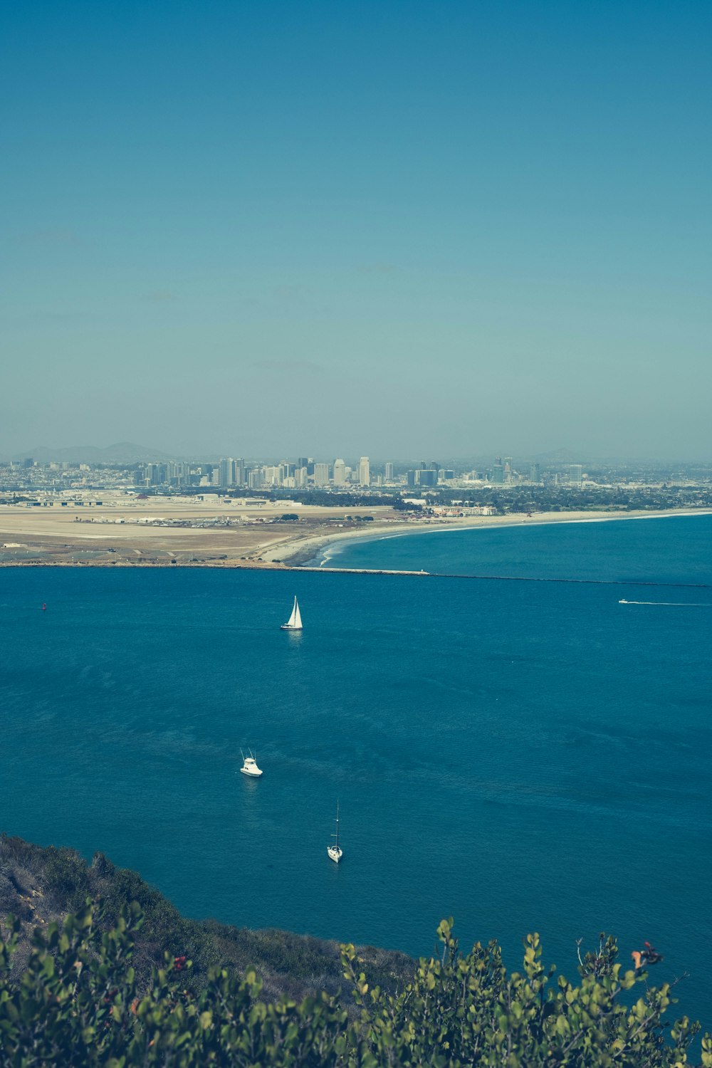 white sailboat on sea during daytime